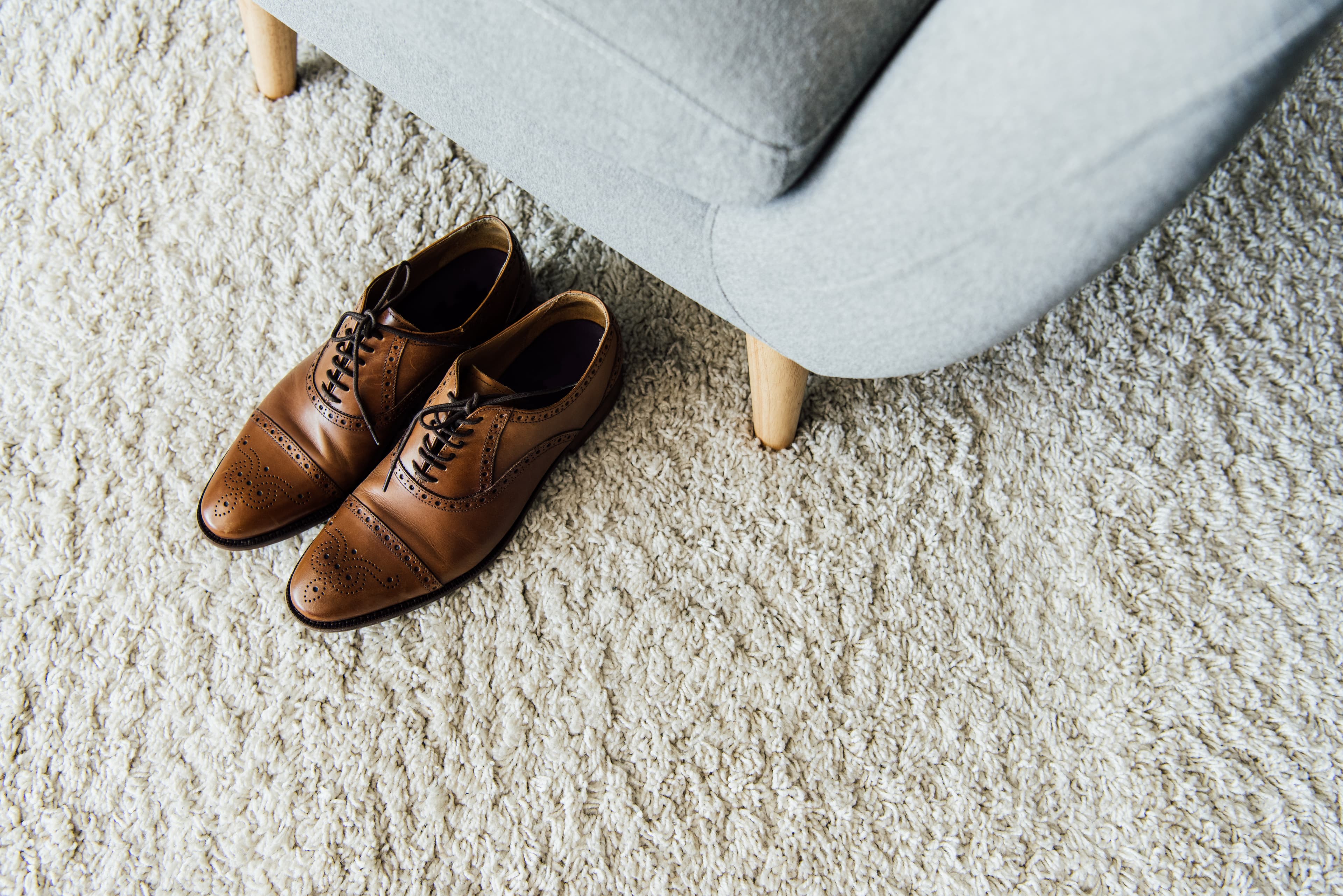 Carpet floor with dress shoes.